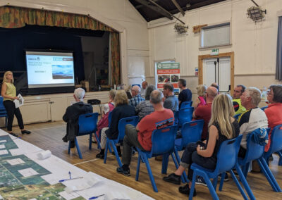 a group of people looking at a presentation